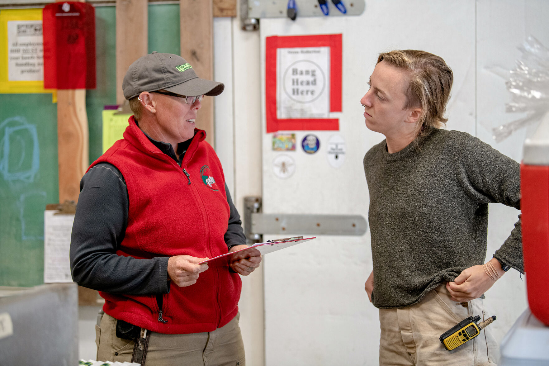 Liz Graznak consults with her pack shed manager Megan Reid